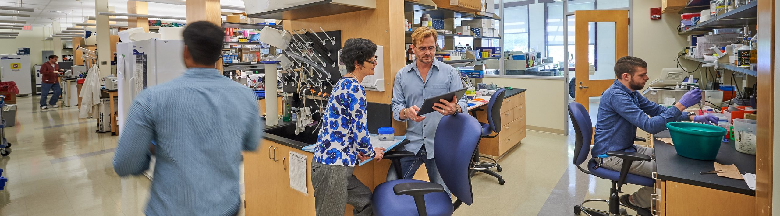three people working in a research lab