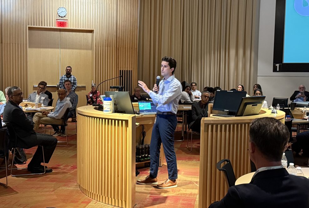 speaker presenting at a conference